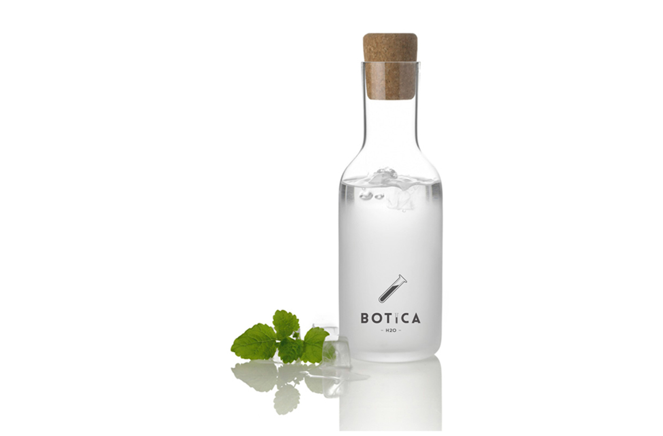 water bottle and mint with botica cafe logo
